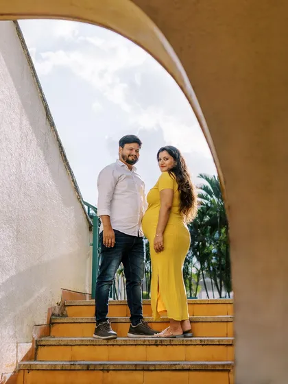 Using the strong lines of this outdoor staircase creates a unique and modern composition. The pop of her yellow dress against the sky makes for a vibrant and joyful maternity photo.