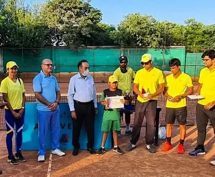One of my U-10 players receiving his winner's certificate at our academy tournament. These events are a great way for kids to apply what they learn in coaching.
