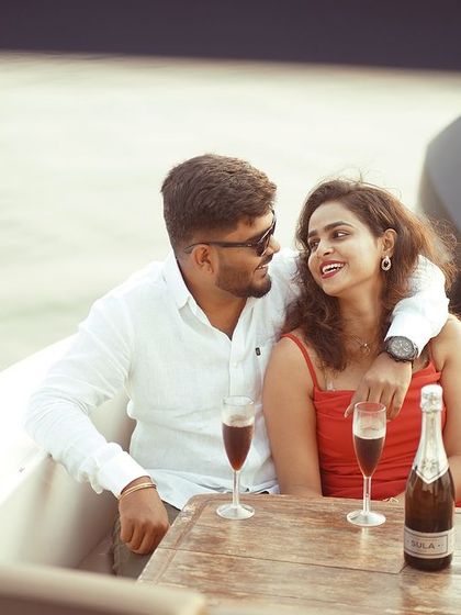 An intimate moment over a bottle of champagne on the back of the boat. Even in a grand setting, I focus on capturing the small, quiet connections.