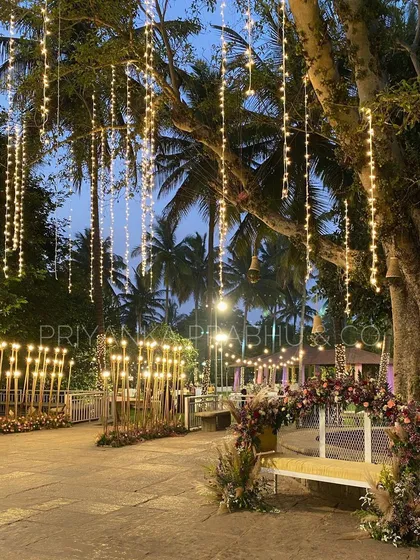 There's nothing more magical than a cocktail night under the stars. For this event, I used cascading fairy lights and warm candle-lit pathways to transform the outdoor space into an enchanting forest.