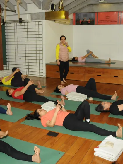 These images showcase the environment of my classes, where real relief is the goal. From hands-on adjustments to group practice and moments of connection, we work together to help you move pain-free.