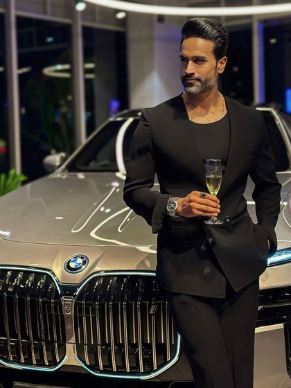 The ultimate statement of modern luxury: our lapel-free blazer paired with a high-performance car.