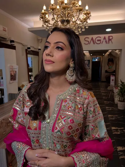 A close-up of the Roka look, focusing on the soft eye makeup and the beautiful, traditional earrings.