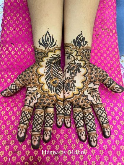 A modern take on a festive design, with peacock feathers and lotus motifs creating a beautiful and unique pattern.