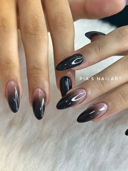 Glossy black ombre nails. A sleek, sexy, and sophisticated look that's perfect for the festive season.