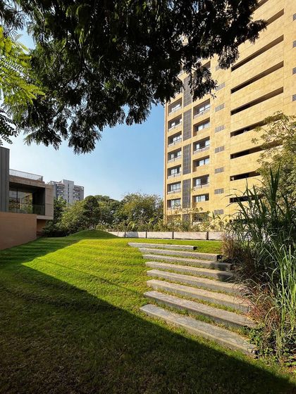 "The rising green" demonstrates how we blend landscape with architecture, with stone steps embedded in a sloping lawn that rises to meet the home.