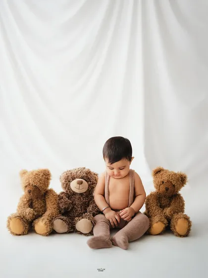 A quiet, contemplative moment from this little one's simple teddy bear session.