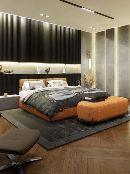 An angled view of the Noida bedroom, highlighting the comfortable lounge chair and the vertical grooves on the wall. This design choice adds height and texture, enhancing the room's modern and luxurious feel.