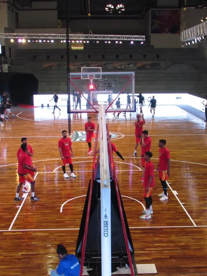 Players gather for a strategy talk during a practice session. Our coaching goes beyond physical drills to include tactical understanding and on-court communication.