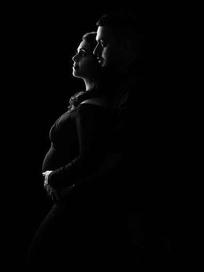 The same powerful couple's silhouette, capturing a moment of shared dreams and quiet strength.