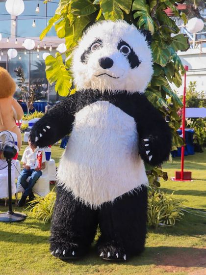 Our Panda mascot enjoying an outdoor event. These characters are versatile and can perform in various settings, from indoor halls to open-air carnivals.