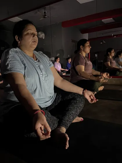 A dimly lit meditation session, creating a serene atmosphere for deep relaxation and introspection.