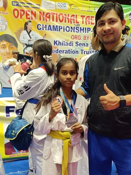 This young girl earned a silver medal through her hard work and dedication.