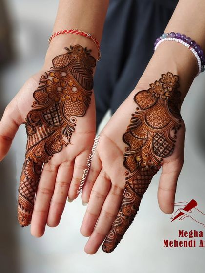 A graceful and modern design that adorns just one side of the palm, perfect for guests or those wanting a minimalist touch of henna.