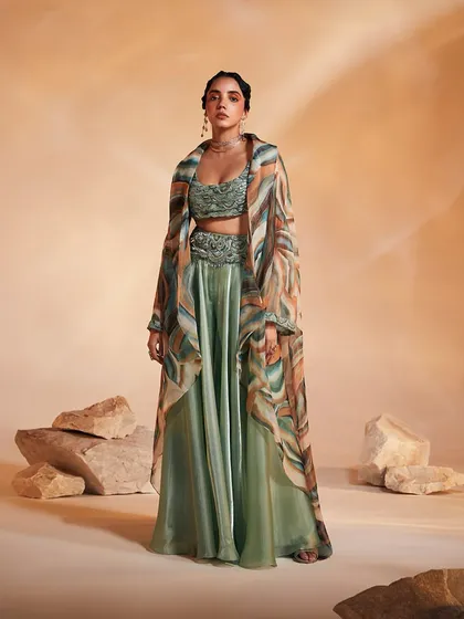 A full-length view of the Adoree Cape Set, showing how the oversized printed cape creates a dramatic and alluring silhouette.