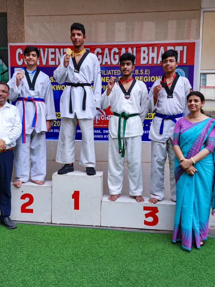 My male students on the victory podium at the CBSE Central Zone Taekwondo Championship.