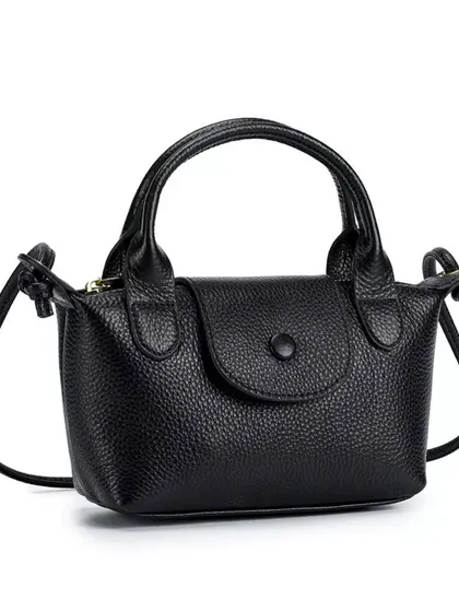 A clean product shot of the Metro Mini in black. This is a timeless and essential piece that you'll use for years.