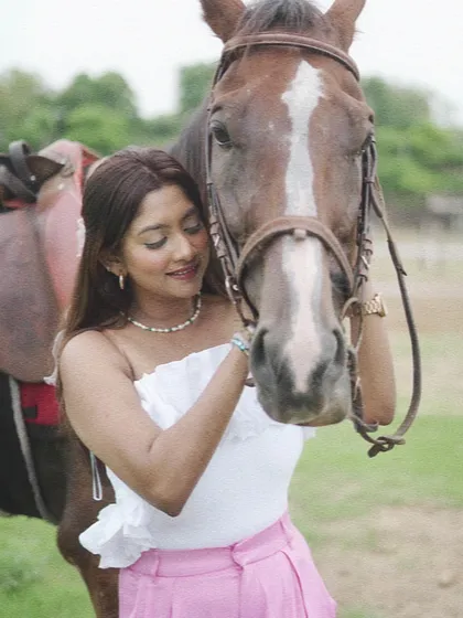 A quiet moment of connection between a rider and her horse. These interactions are just as important as the ride itself.