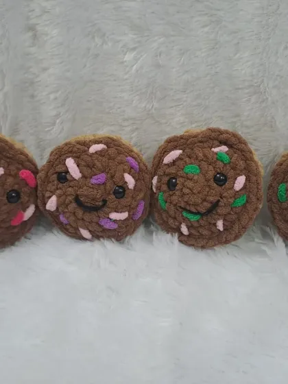 For chocolate lovers, I make these brown cupcake plushies. Each one has a happy, smiling face.