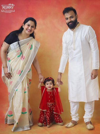 A beautiful family dressed in traditional attire for a Janmashtami themed photoshoot. The little girl dressed as Radha with her parents looks absolutely lovely.