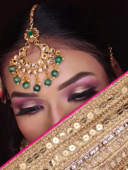 Another creative shot of the bridal eye makeup, highlighting the maang tikka and the beautiful eyeshadow blend.