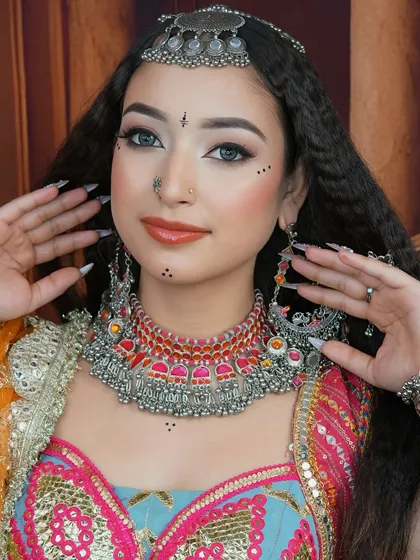 This shot focuses on the intricate necklace and earrings, showing how we teach students to harmonize makeup with heavy traditional jewelry for a cohesive look.