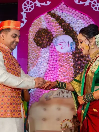 The official ring exchange between Swapnil and Ankita on stage. Capturing this moment is essential for their wedding story.