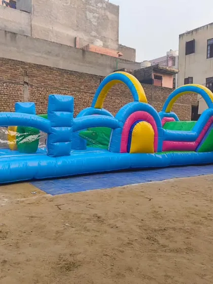 A full view of the new inflatable obstacle course, showcasing its length and the variety of challenges from start to finish.