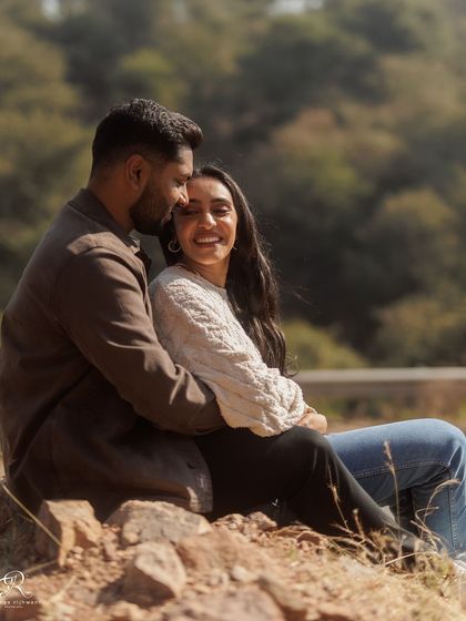 A sweet moment from their engagement session. Her genuine smile as he holds her close is what makes this photograph so heartwarming. It’s a simple, beautiful portrait of their connection.