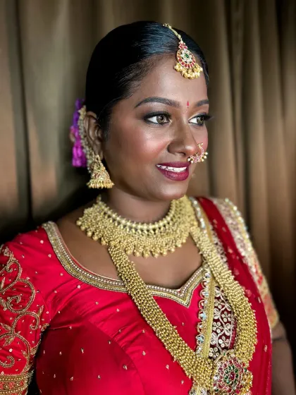 A side profile showing how the highlighter catches the light, giving her a beautiful, natural glow.