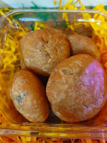A close-up of the golden, flaky Dal Kachoris, a savory favorite for Holi.