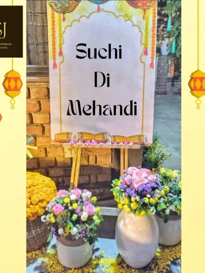 A personalized welcome sign for 'Suchi Di Mehandi', surrounded by beautiful floral arrangements, setting a warm and inviting tone for the event.
