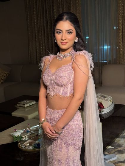 The full look, showcasing the delicate lavender couture gown. The makeup is kept light and radiant to match the dreamy, feminine vibe of the outfit.