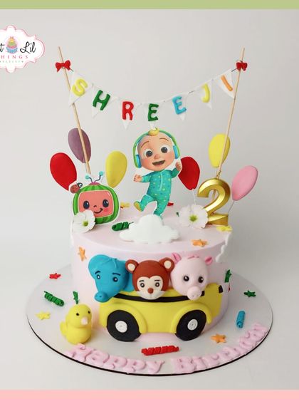 The wheels on the bus go round and round! This adorable Cocomelon cake for a 2nd birthday features JJ and his animal friends on their iconic yellow bus.