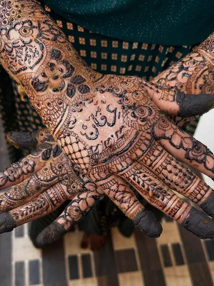 Your mehendi should tell your story. Here, I've carefully woven the groom's name, Irfan, into the intricate bridal design on the palm, making it a beautiful secret for him to find.