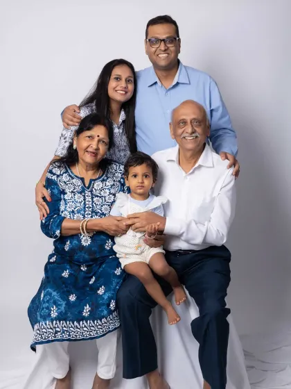 Grandparents with their grandchild create such special memories. This intimate portrait focuses on the beautiful bond across generations, a true family heirloom.