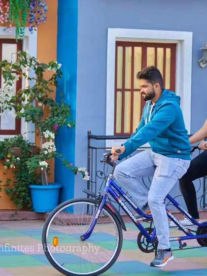 A tandem bicycle ride through our colorful, street-style set makes for a fun, dynamic, and cheerful pre-wedding photograph.