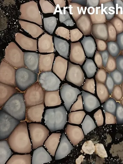 A finished pebble resin art piece. The combination of different coloured pebbles and textures creates a stunning and realistic effect.