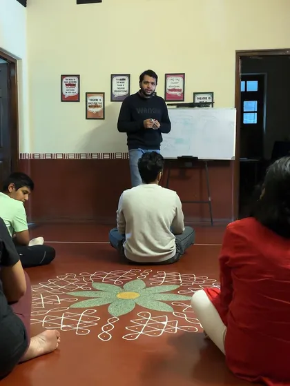 An instructor guides students through the principles of stagecraft. Our workshops provide a comprehensive foundation in all aspects of theatre performance.
