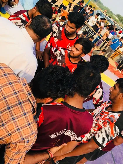 A team huddle before a big raid. Unity and communication are our biggest strengths on the mat.