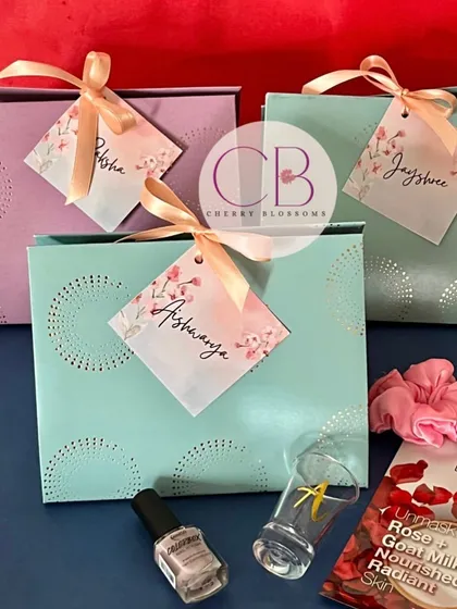 These pastel-themed bridesmaid hampers were sent to a destination wedding in Goa. Each gift bag included a customised shot glass, a face sheet mask, a scrunchie, and a nail paint.