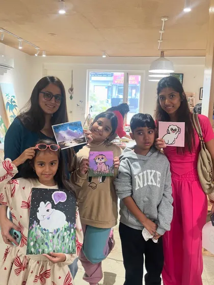 A group of kids with their charming animal paintings. Our drop-in sessions allow children to choose what they want to paint and express their creativity freely.