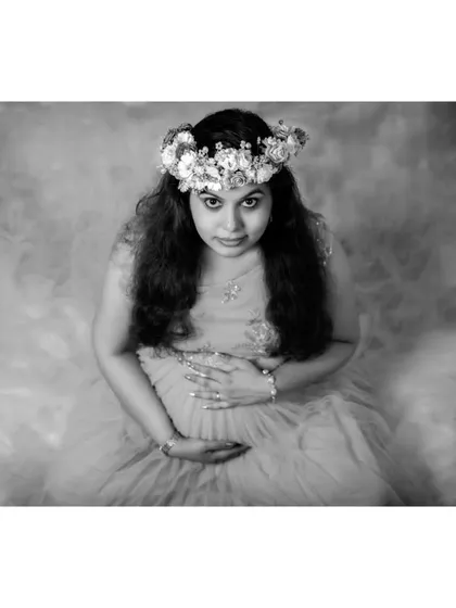 Another artistic angle from the studio session, this time in black and white. The smoky, ethereal background adds a sense of mystery and timelessness to the portrait.