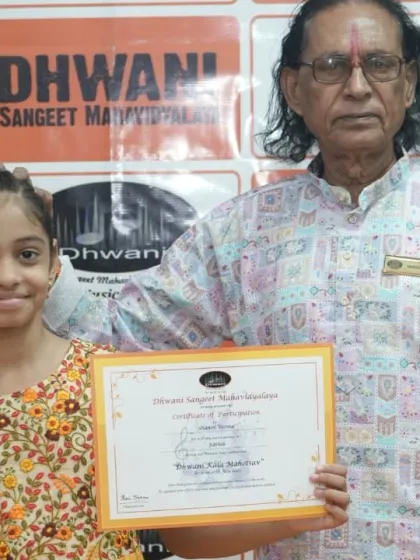 Our senior guru blesses a young student with her award. This moment reflects our deep-rooted belief in the Guru-Shishya tradition.