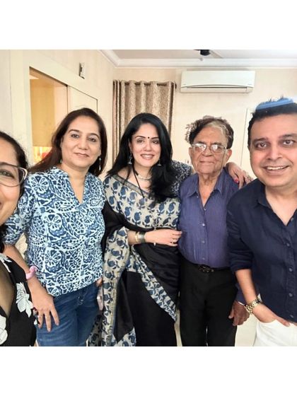 A happy group photo with family. My saree feels comfortable and appropriate for a relaxed afternoon filled with laughter.