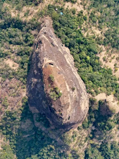 An aerial view of the Gorakhgad pinnacle in the Sahyadri mountains, a source of inspiration for us. This teardrop-shaped mountain showcases the power and beauty of natural rock-cut architecture.