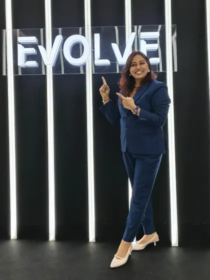 Dressed for success and ready to command the stage at the Evolve AI Edition summit. My presence as a corporate host is professional and confident, setting the right tone for business events.