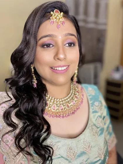 Another angle of this soft and pretty reception look. The makeup enhances her features and gives her a radiant, youthful glow.