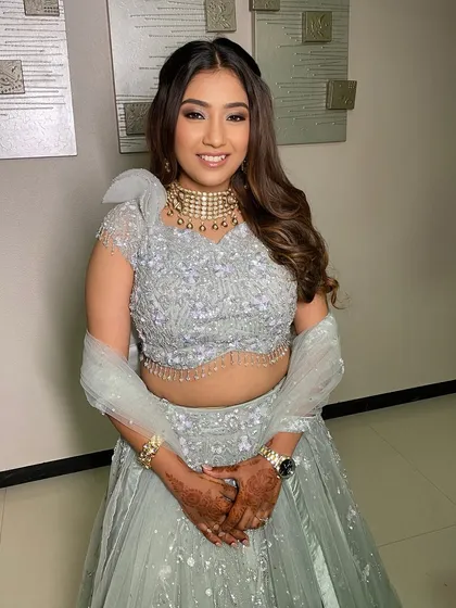 A lovely engagement look for Zeal. The makeup is soft and pretty, with a focus on the eyes, complementing her mint green lehenga.
