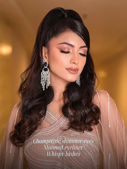 A glamorous look for an evening event. This features champagne shimmer eyes, minimal eyeliner, and wispy lashes, a versatile style that suits many different occasions and skin tones.